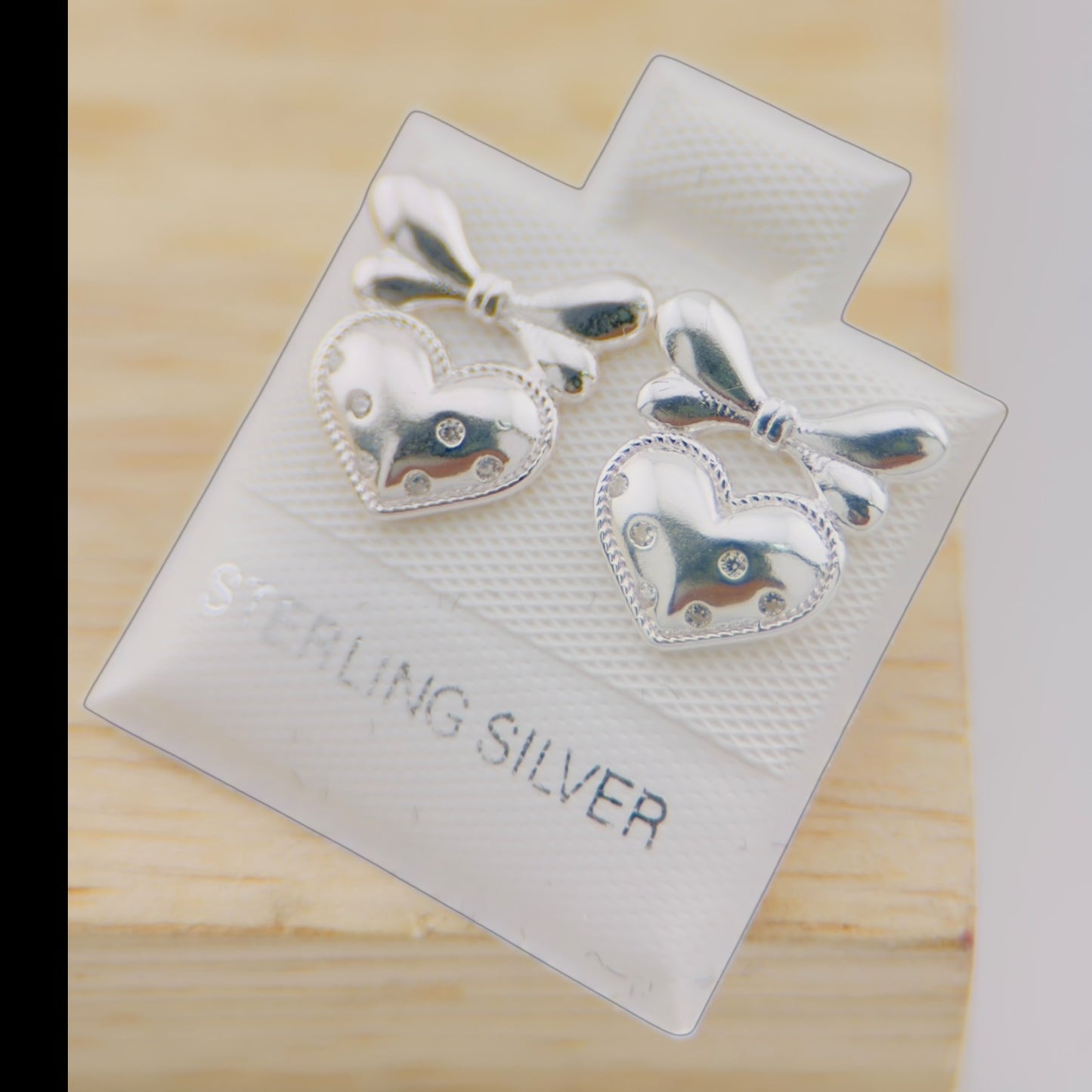 Aretes Corazón con Moño Plata 925