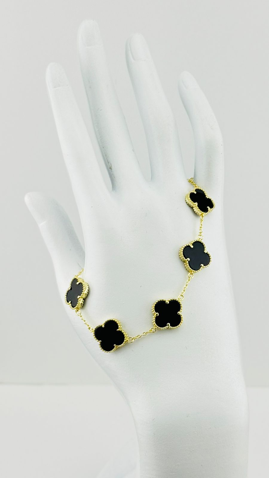 Pulsera trébol negro en plata con baño de oro