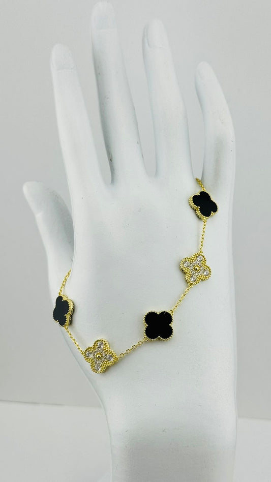Pulsera trébol negro con circonitas en plata con baño de oro
